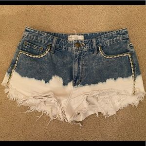 ripped jean shorts with pockets hanging out